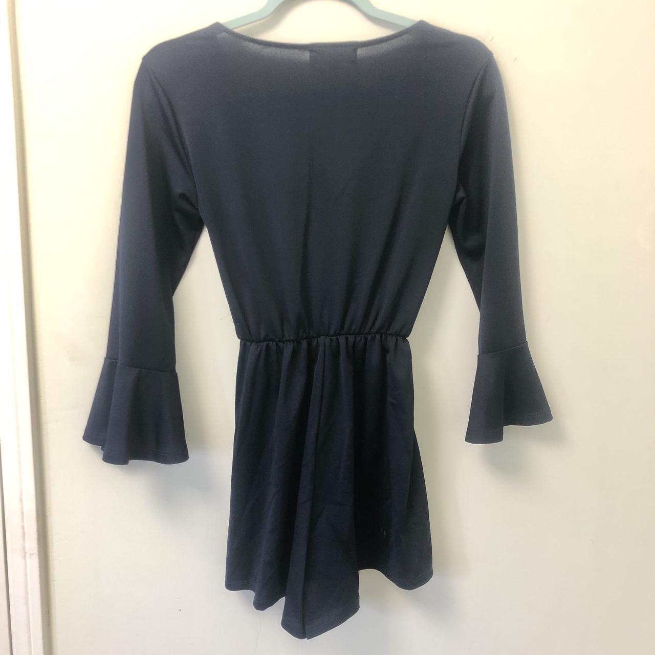 No Comment navy blue romper with ruffle sleeves and