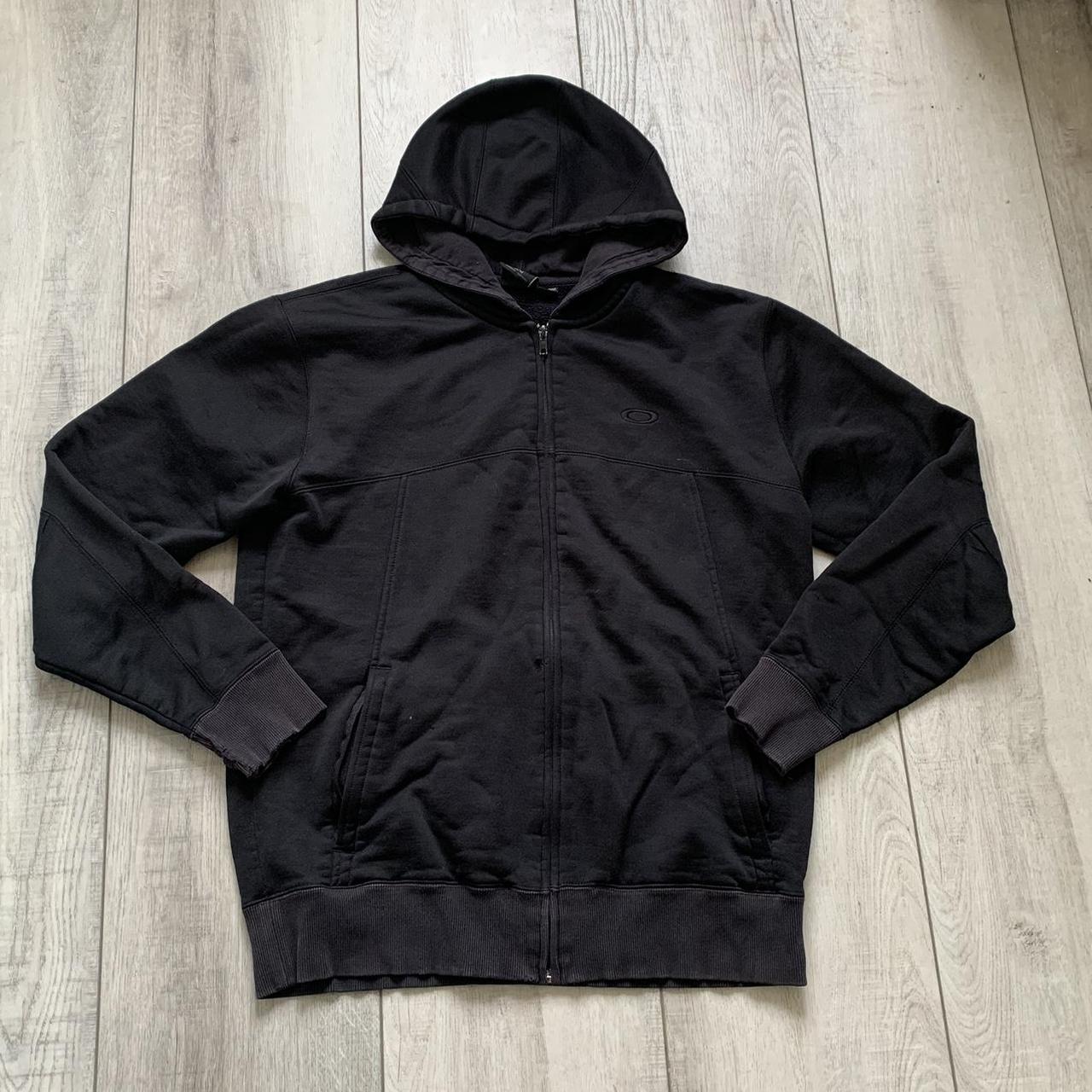 Black Oakley black zip up hoodie with finger hole... - Depop