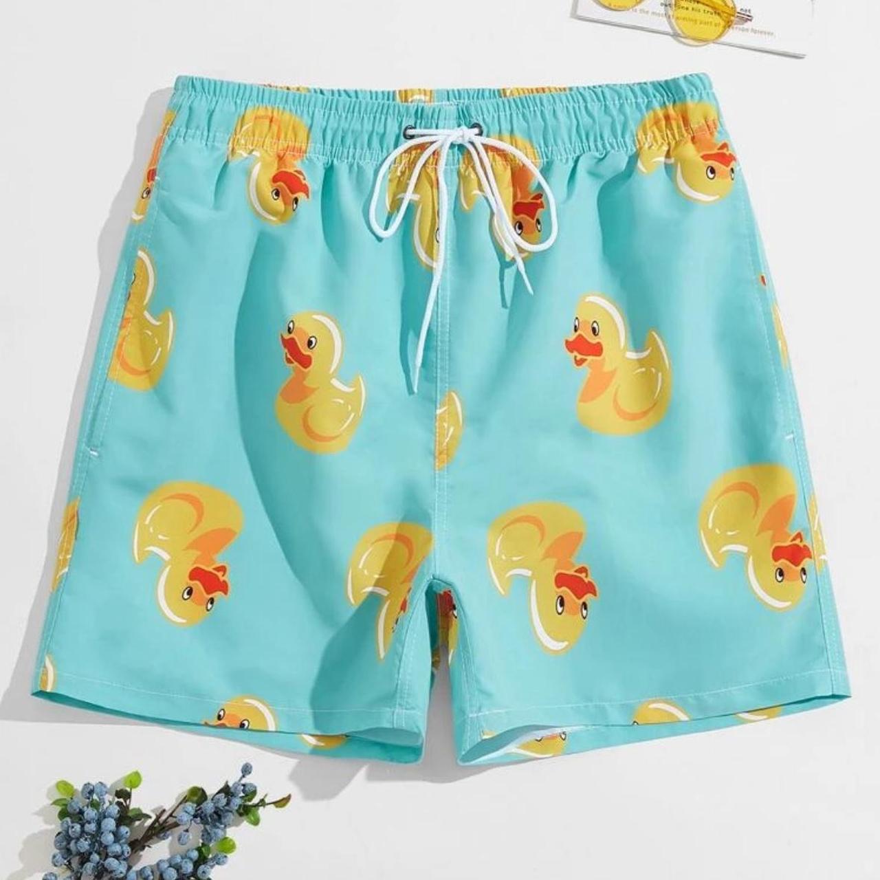 Blue swim trunks with rubber duckies. swimtrunks Depop