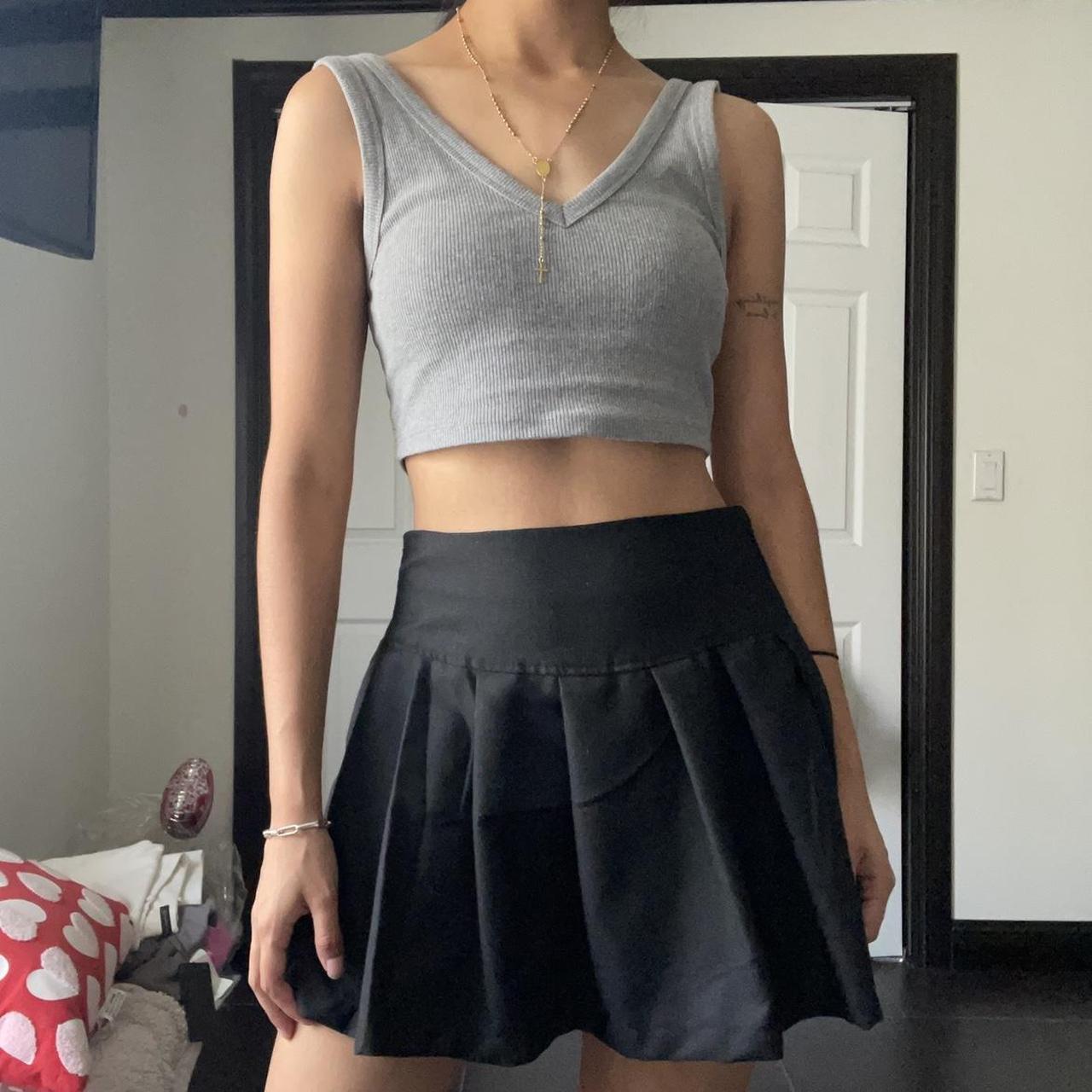 Black pleated mini skirt very flattering