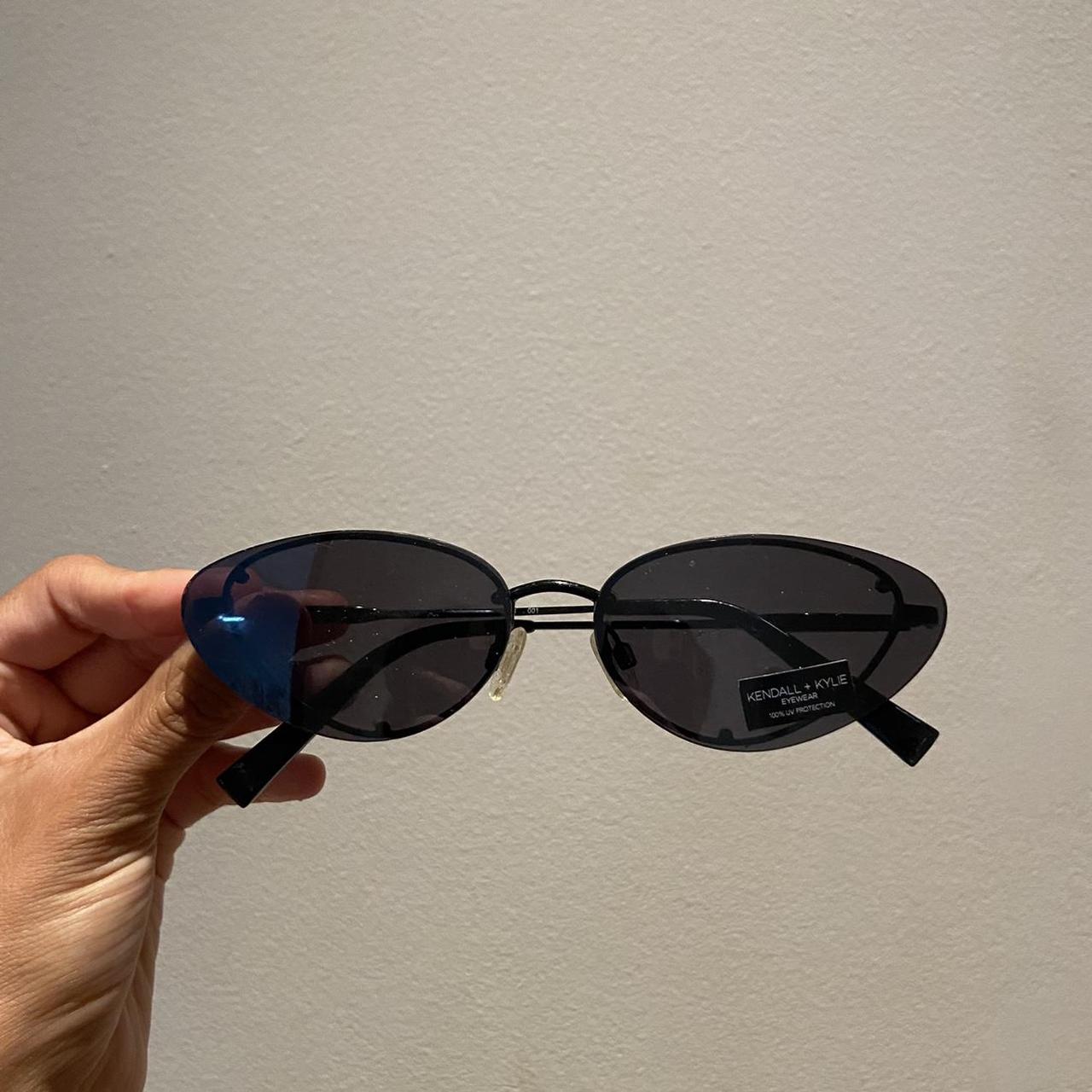 Black oval cat eye sunglasses with a vintage Depop