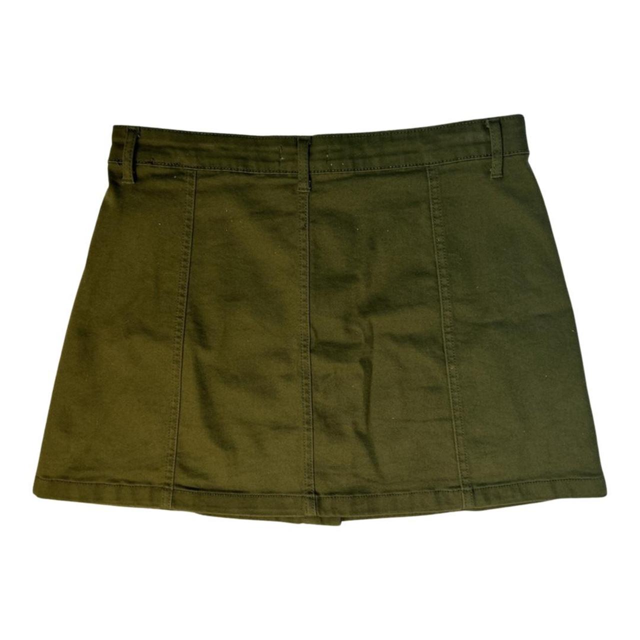 The olive green denim skirt with gold front buttons... - Depop