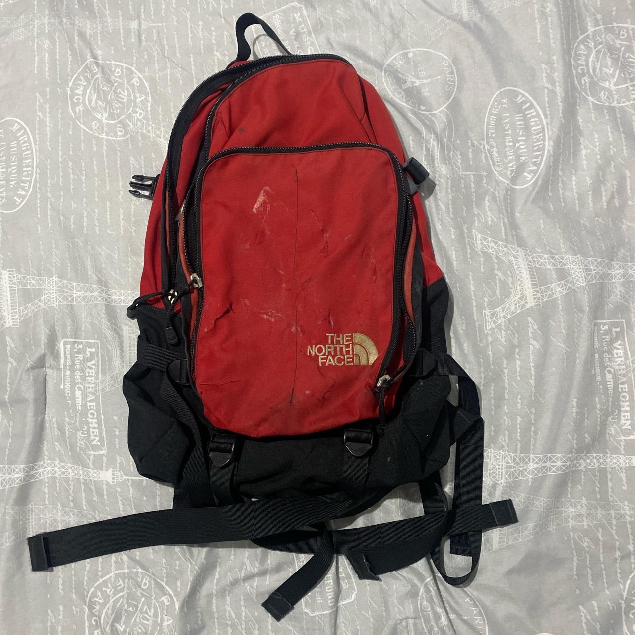The North Face Vintage backpack has small tear in... Depop