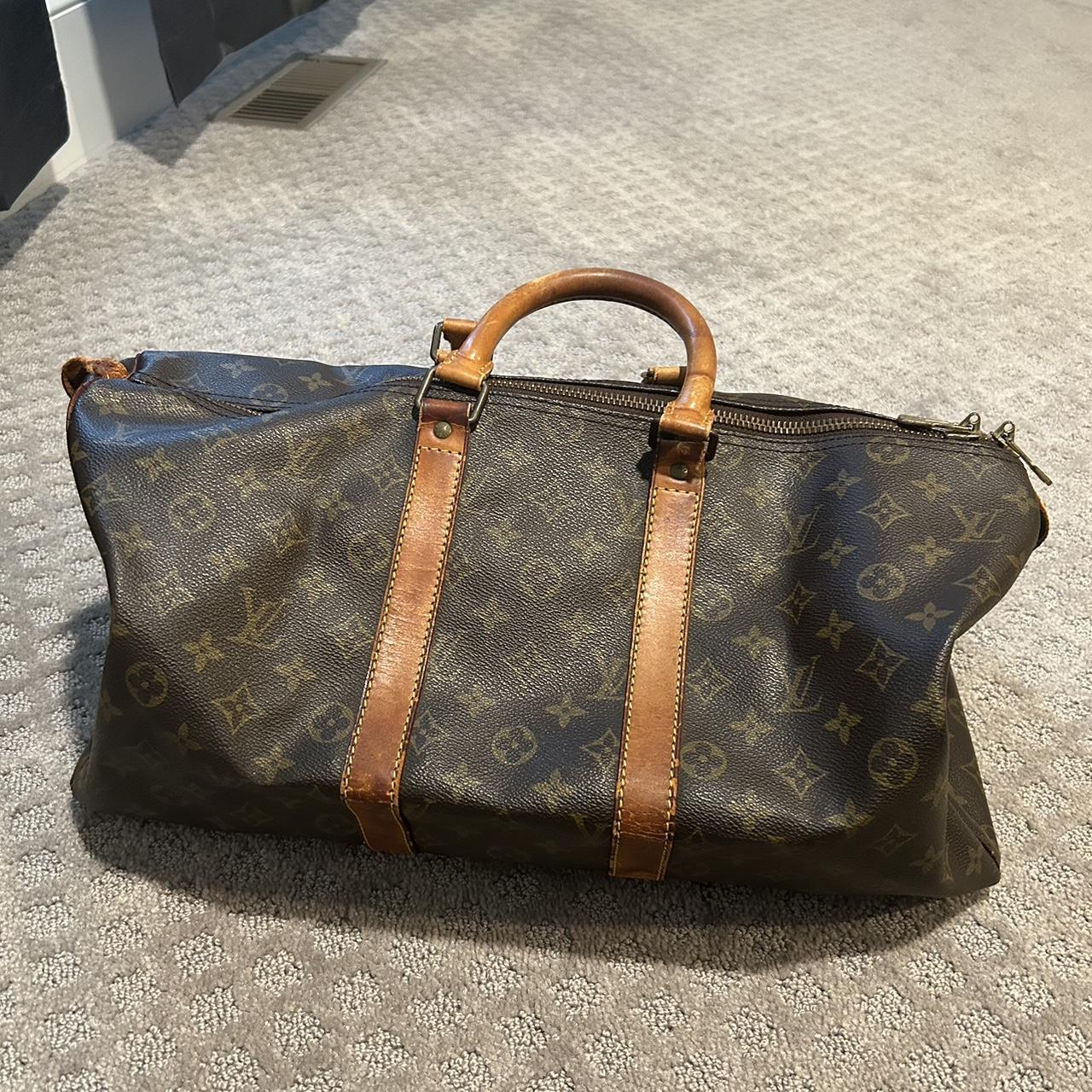 A Louis Vuitton Duffle bag. Used but in very good - Depop