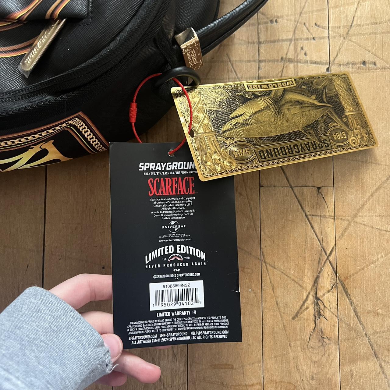 sprayground gold ticket