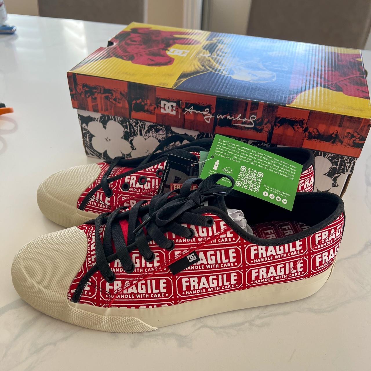 white and red dc shoes