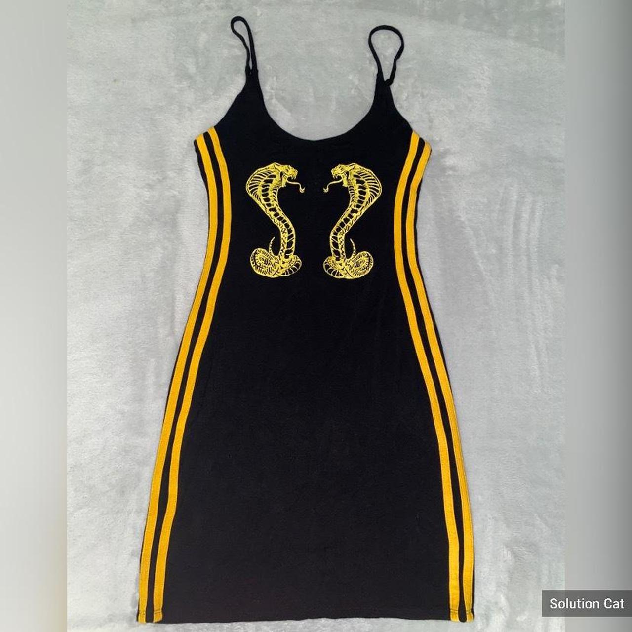 Shane justin black and gold outlet dress