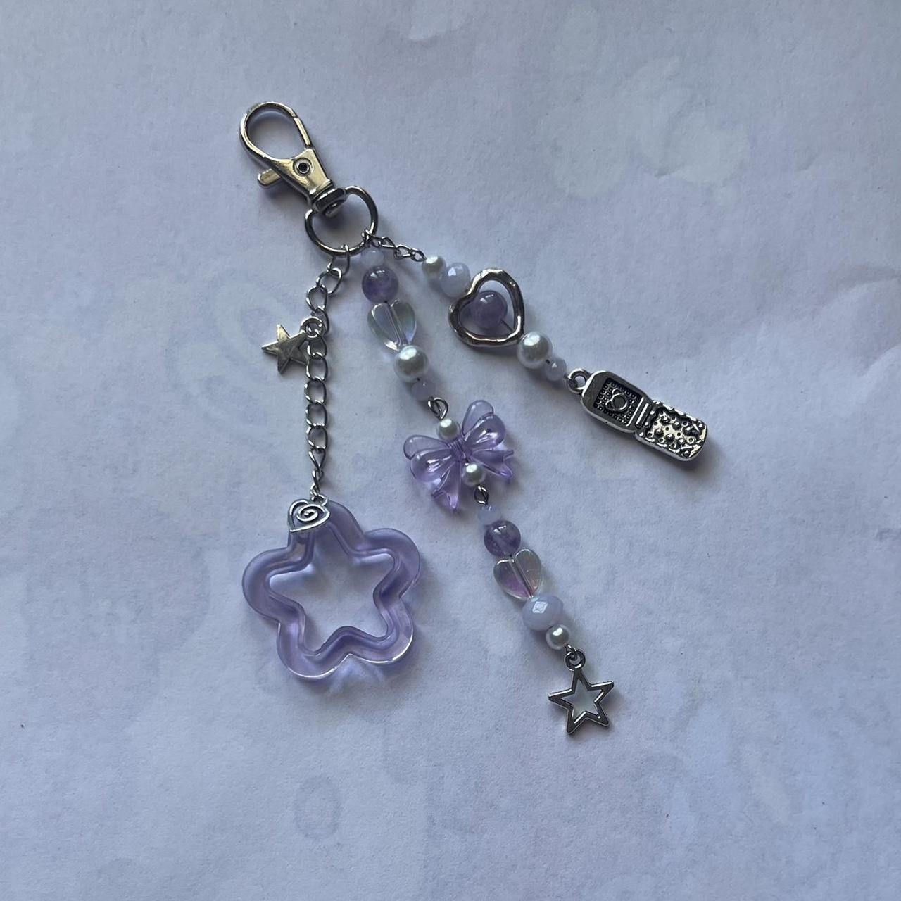 a fun purple themed keychain! includes an adorable... - Depop