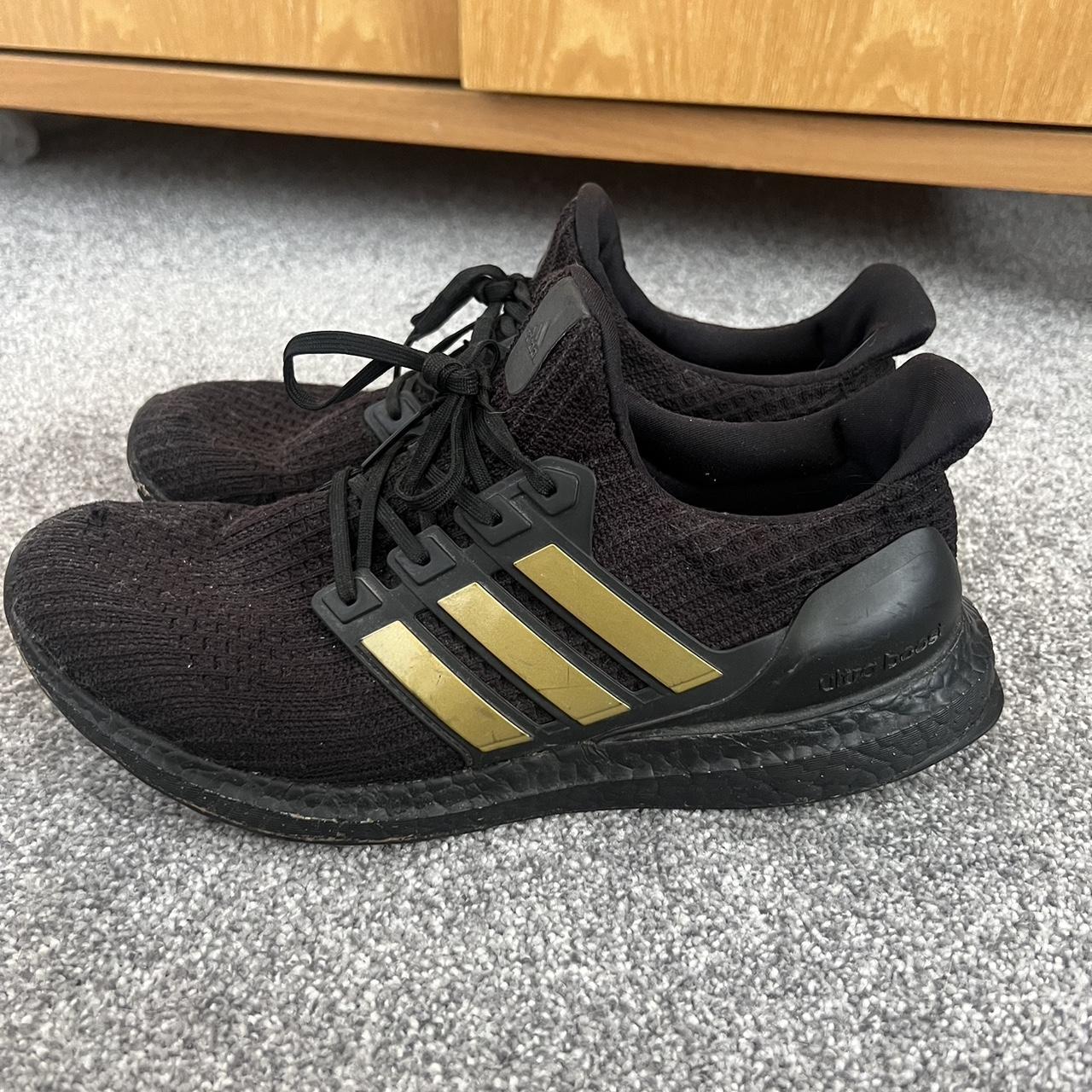 Adidas black and gold ultra boost trainers Slight