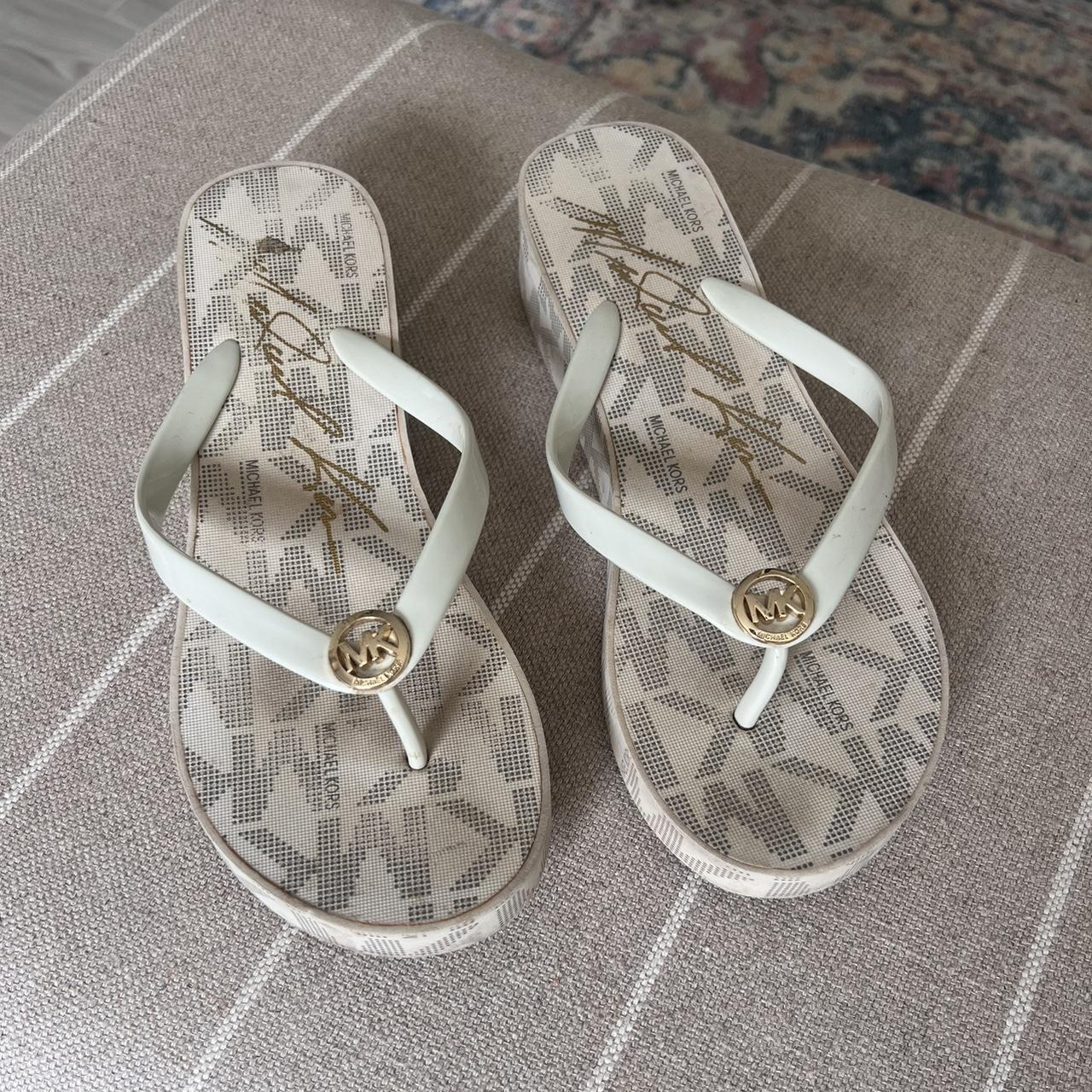 Michael Kors wedge flip flops with gold logo. Depop