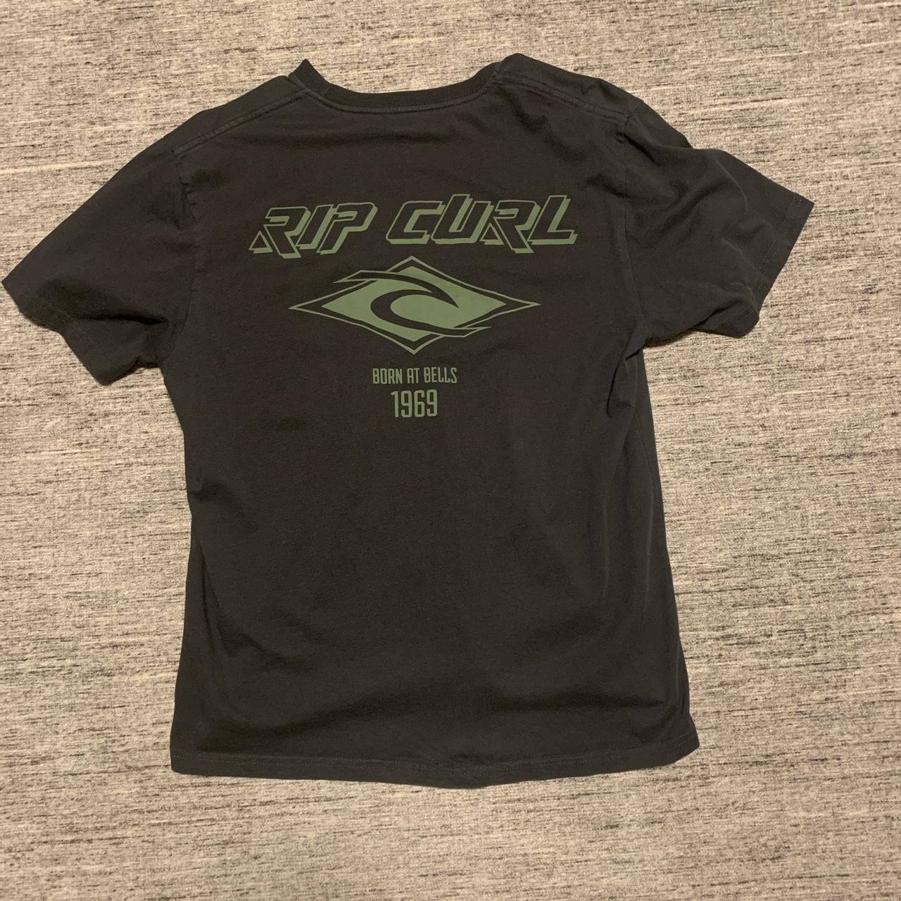 Medium black rip curl shirt with nice simple graphic... - Depop