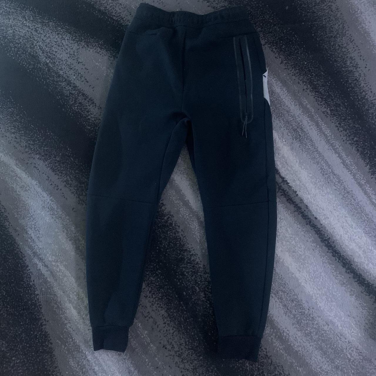 Black and grey Nike tech fleece bottoms 10/10... - Depop