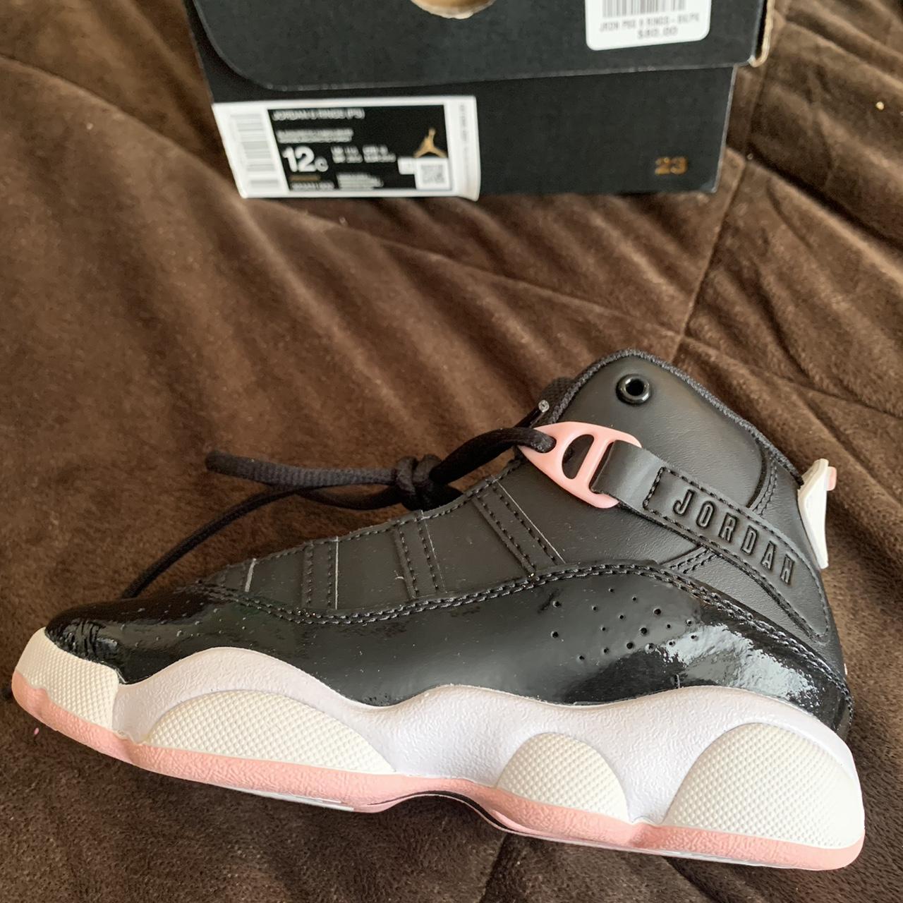 Girl jordans hotsell black and pink