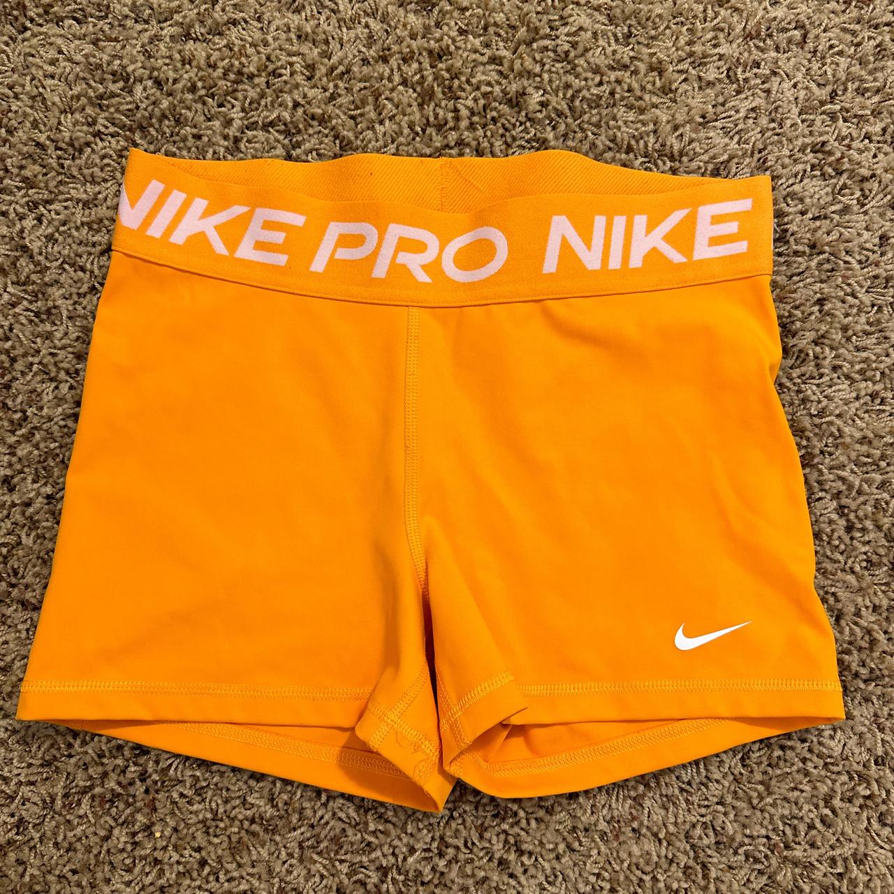 black and orange nike pro shorts