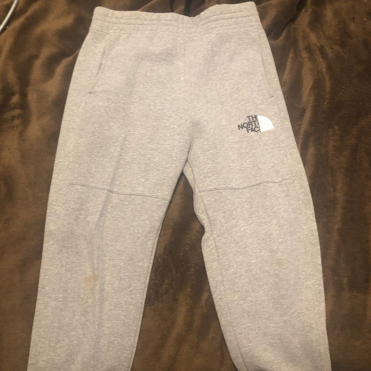 North face grey joggers, barely worn as got a stain... - Depop