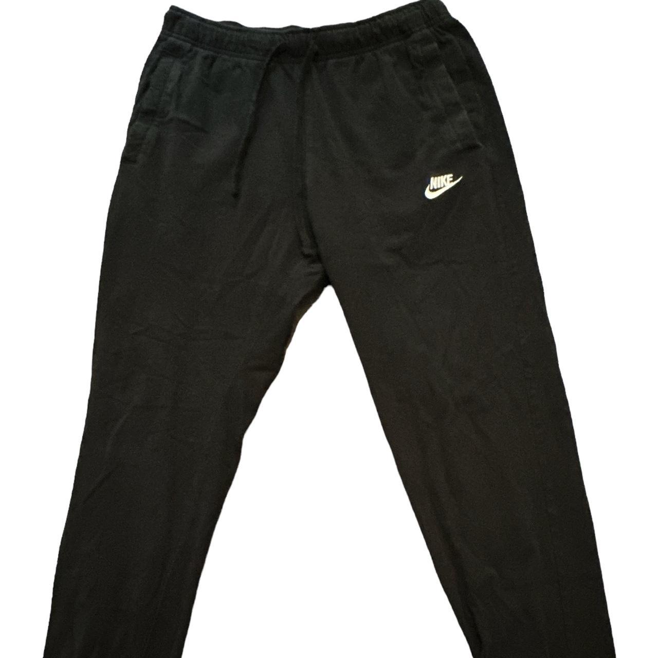 Black cuffed Nike sweatpants - Depop