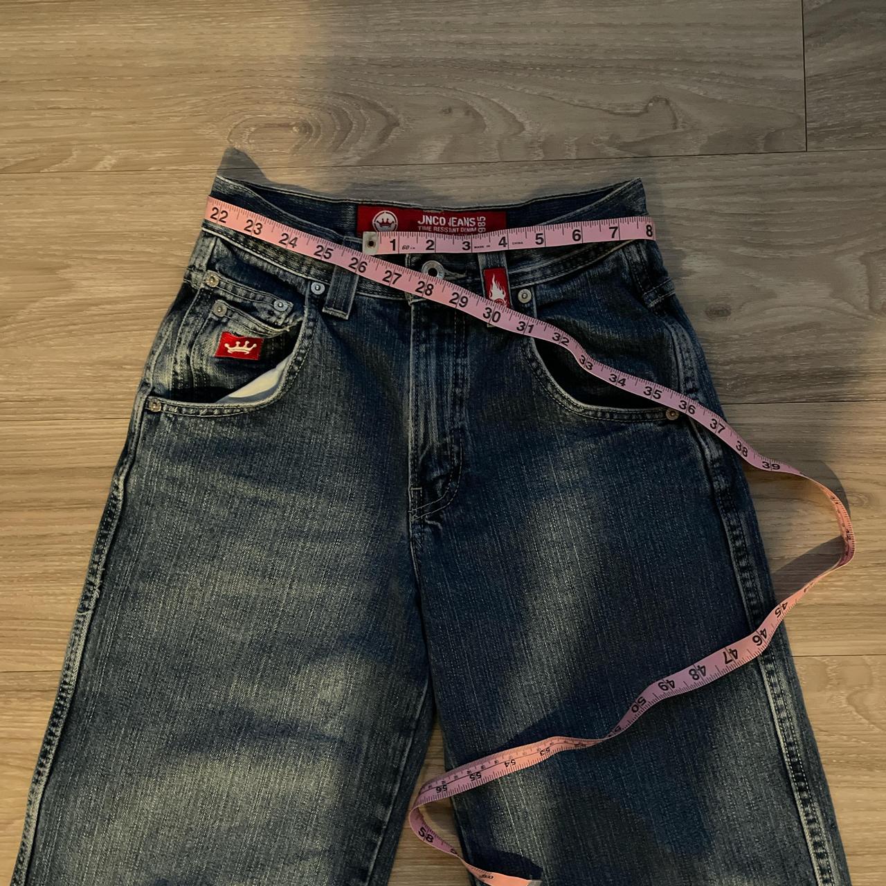 blue denim jnco jeans with a blue tiger on the back | Depop