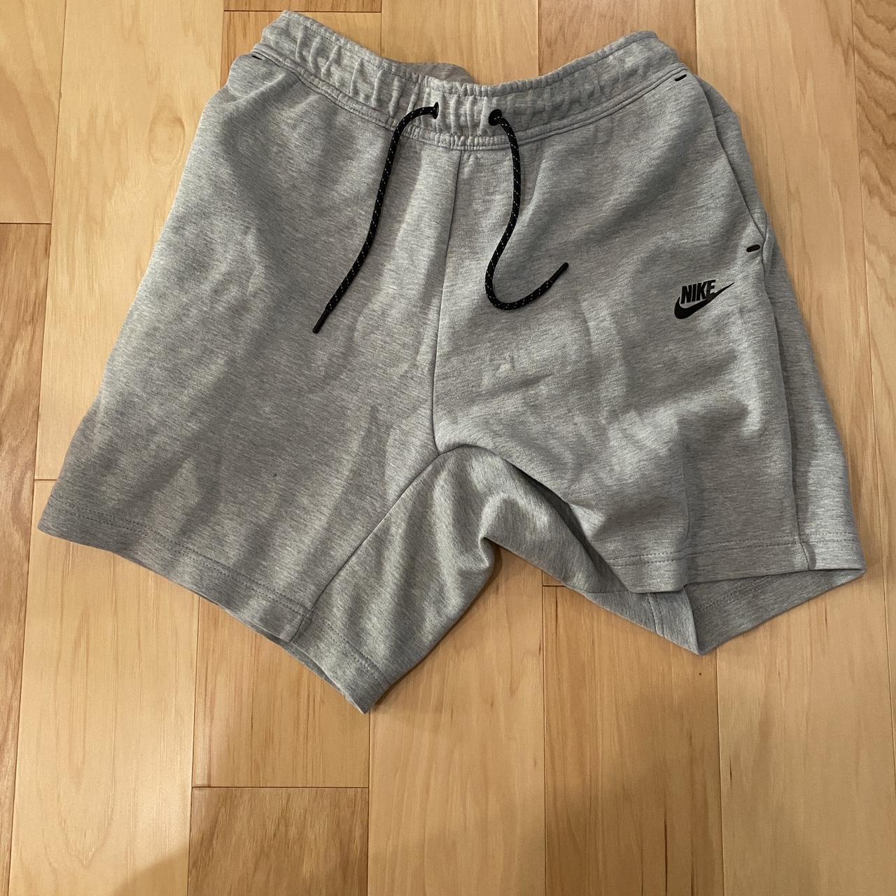 Grey Nike Tech shorts Only flaw is the zipper has... - Depop