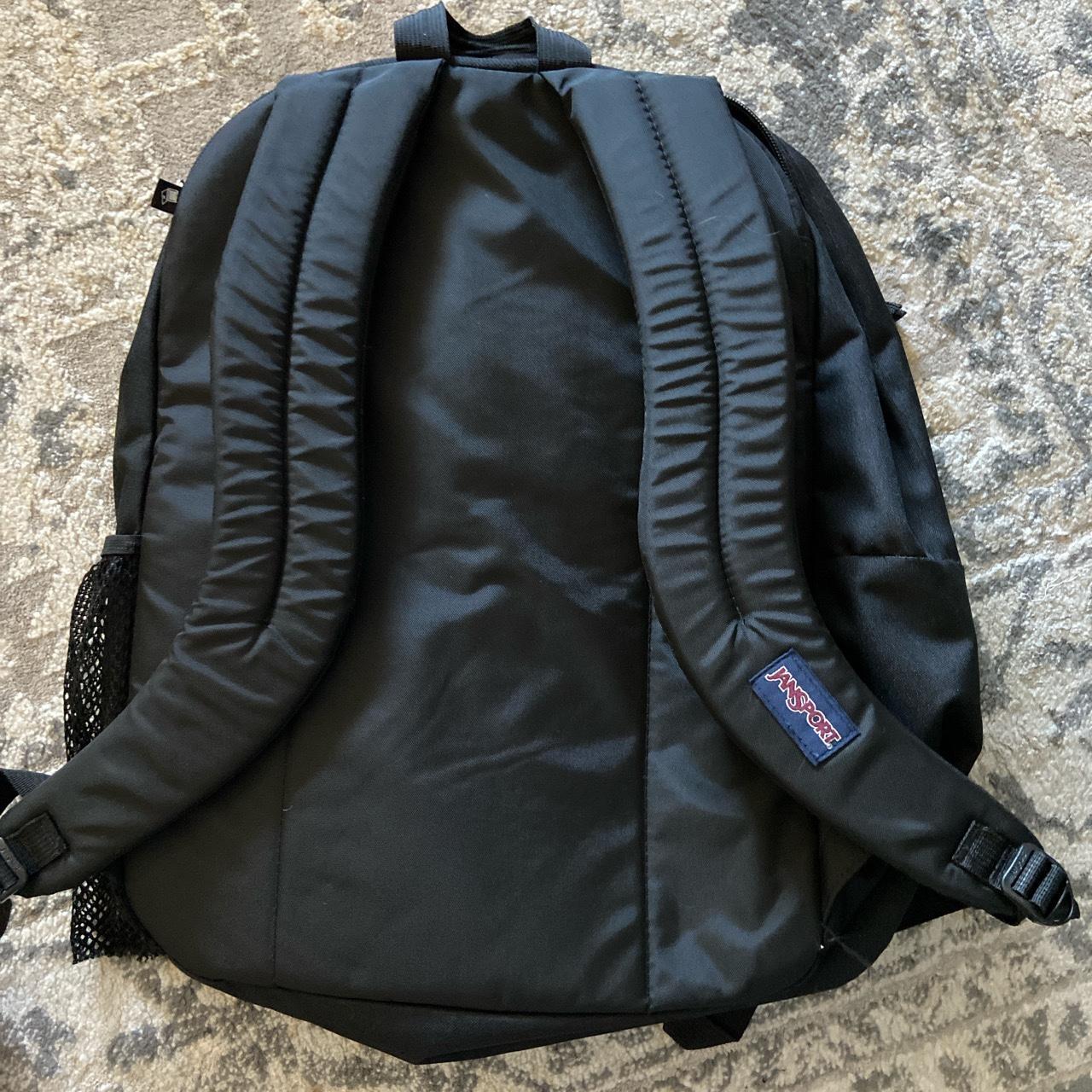 black jansport backpack has a rip in the side... Depop