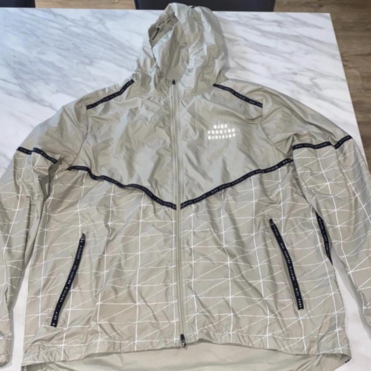 Nike jacket Gold and reflective Size large Great. Depop