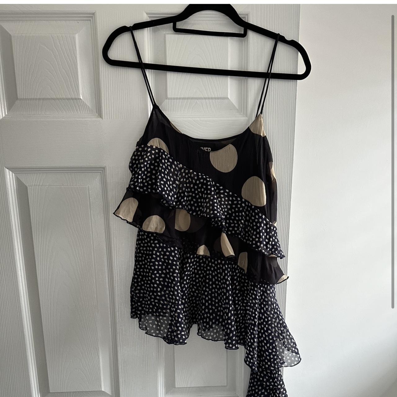 Navy polka dot ruffle top perfect for a night out!