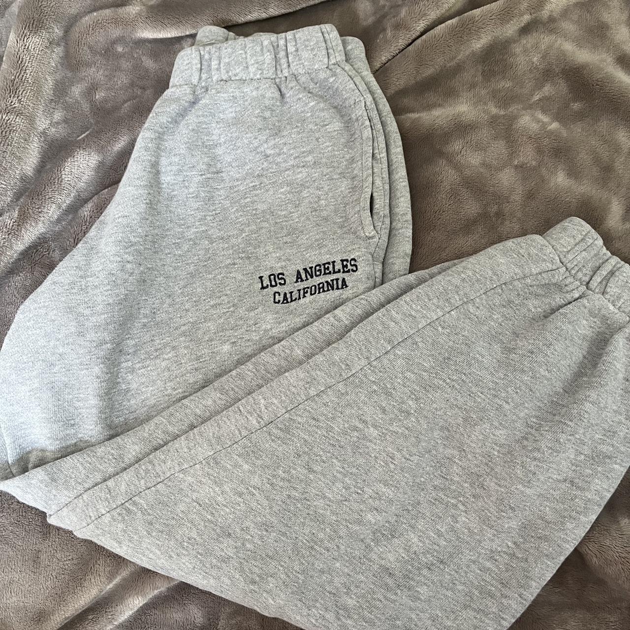 grey la sweatpants from brandy melville too short... Depop