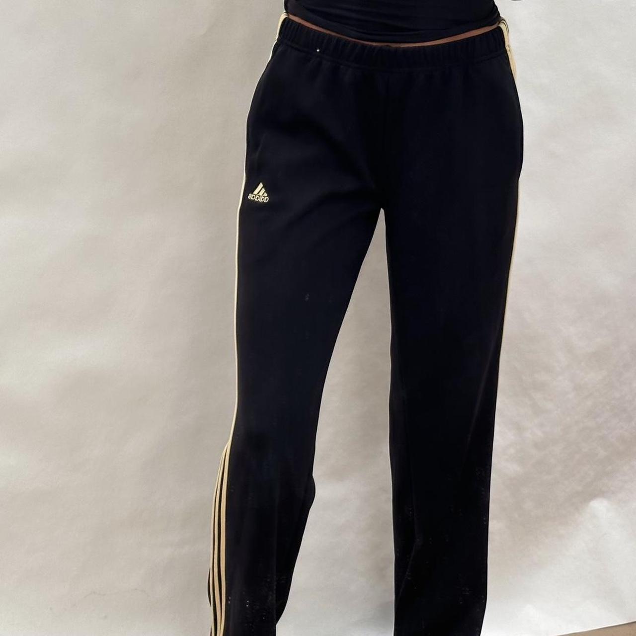 Adidas black pants 2024 with gold stripes