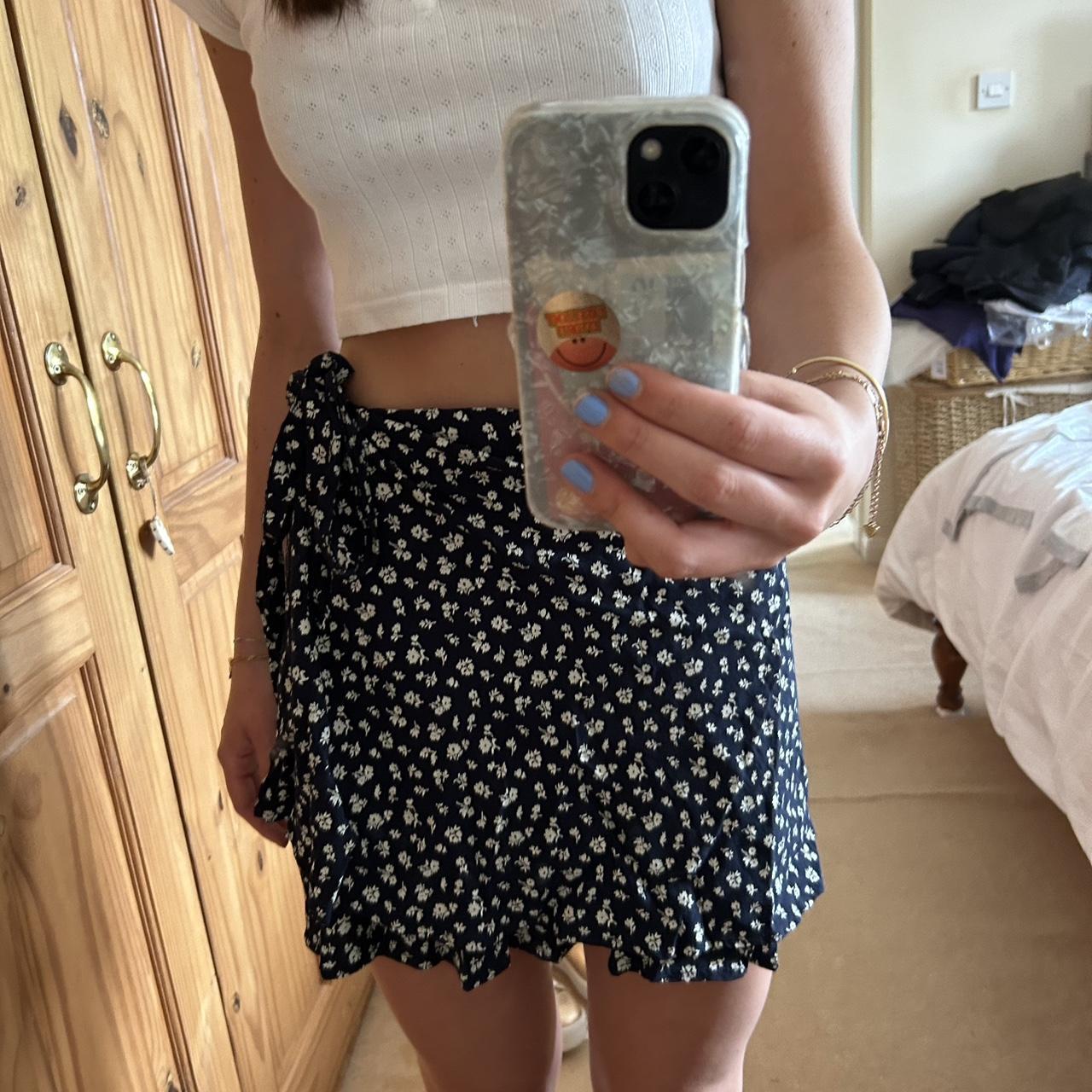 One size brandy Melville navy wrap mini skirt.... Depop