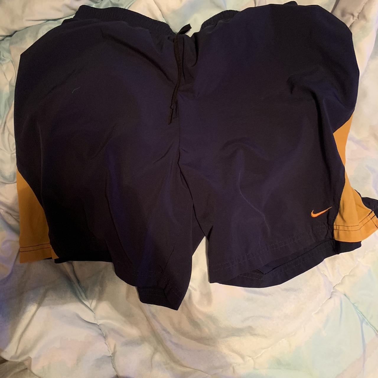 navy blue and orange nike shoes