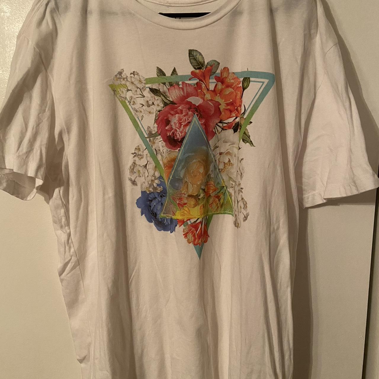 White t with a floral icon in the front Depop