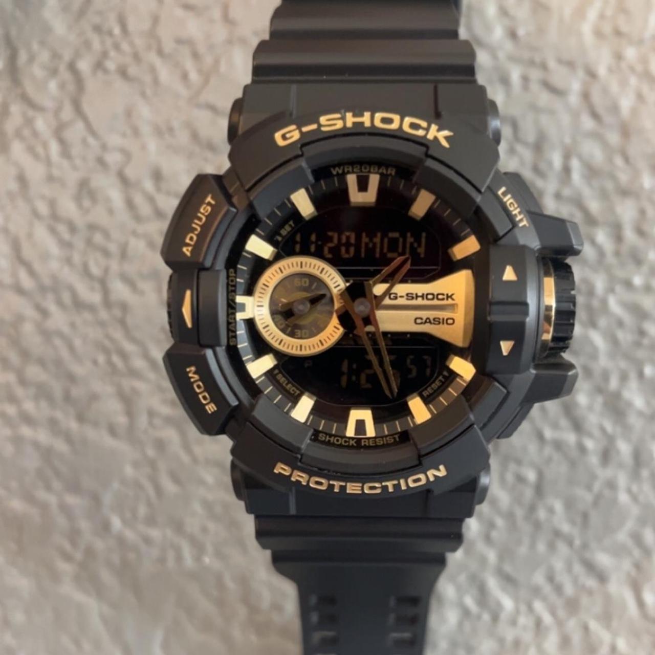 Mens black and gold chronograph G-Shock watch. In... - Depop
