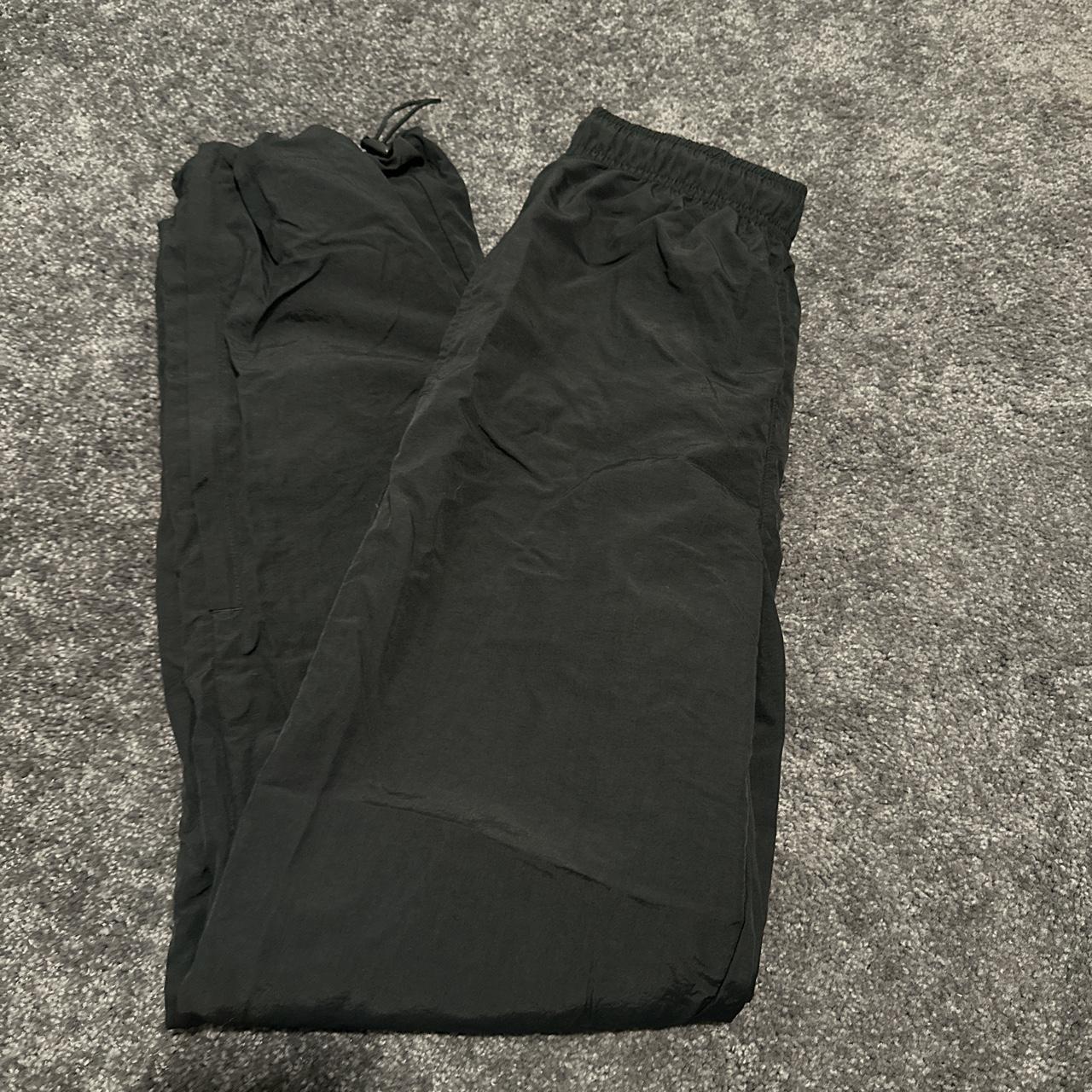 DSG black parachute pants with adjustable bottoms... Depop