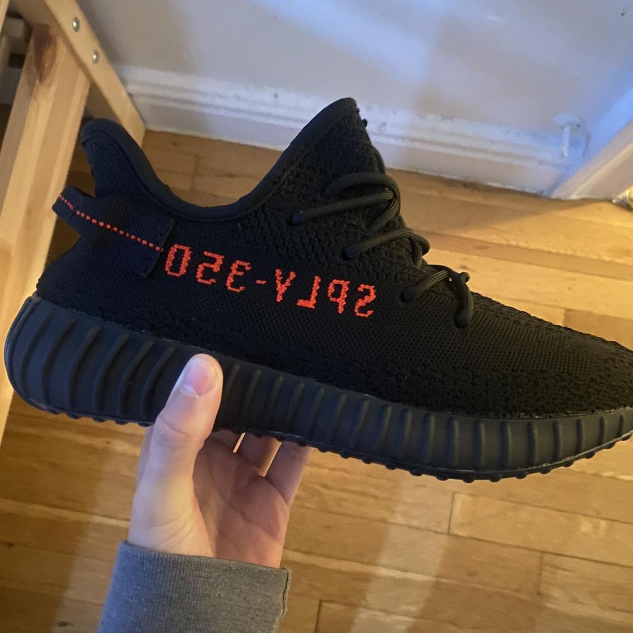 Black Yeezy adidas 350 shoes with the red writing.... - Depop