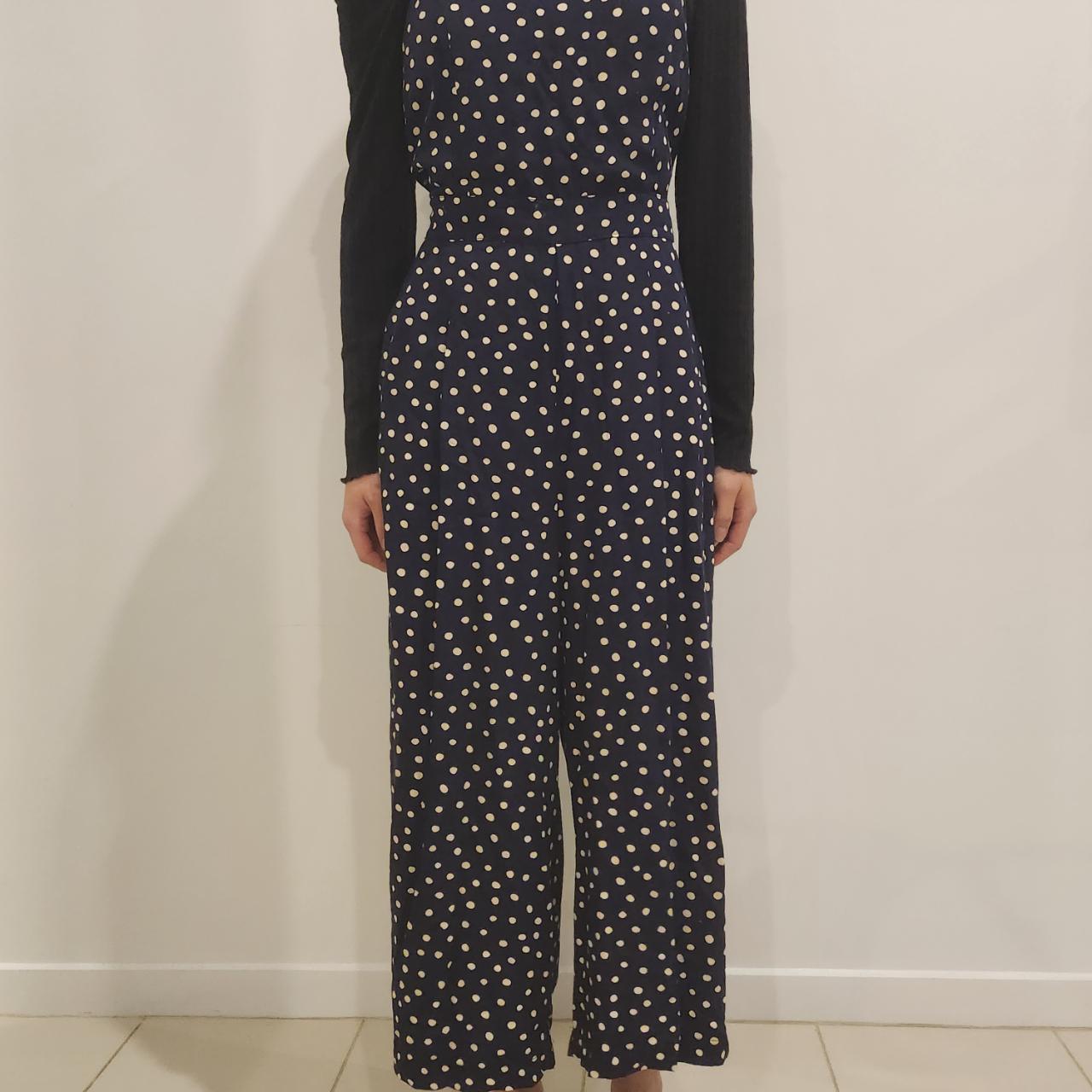 Navy blue jumpsuit with white polka dots. Brand:... - Depop