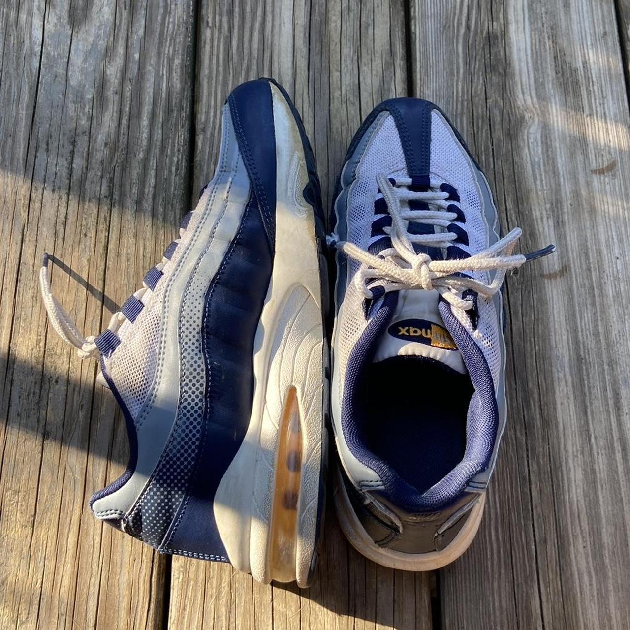 navy blue and gold sneakers