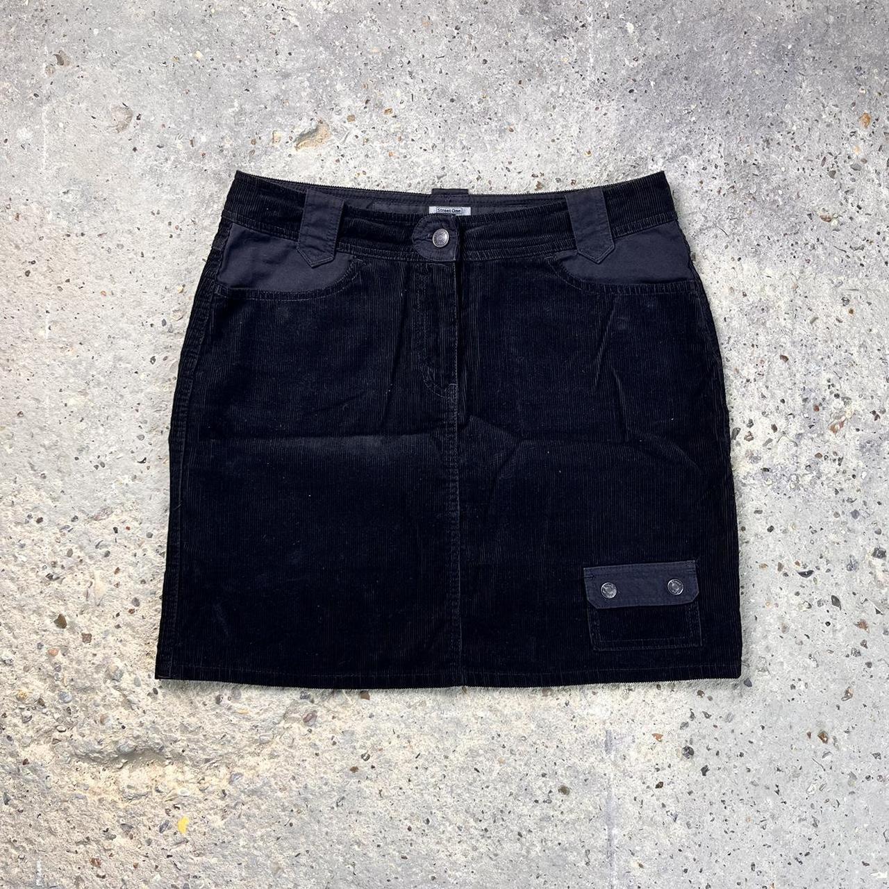 Black corduroy mini skirt with two front pockets and