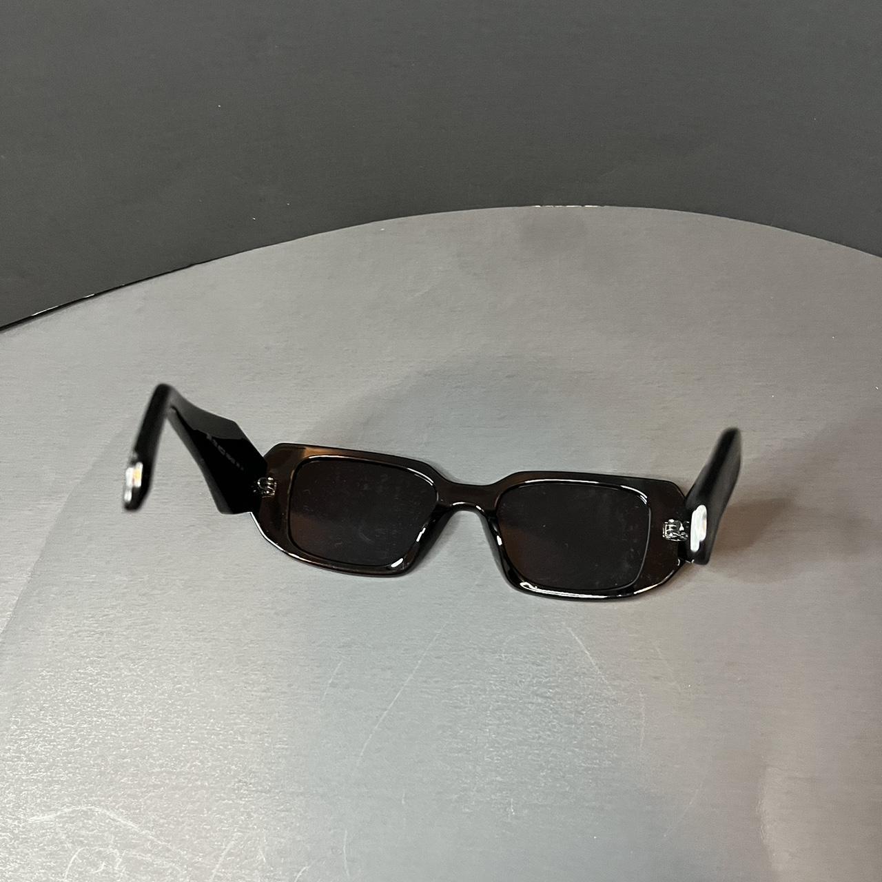 Prada Women's Black Sunglasses | Depop