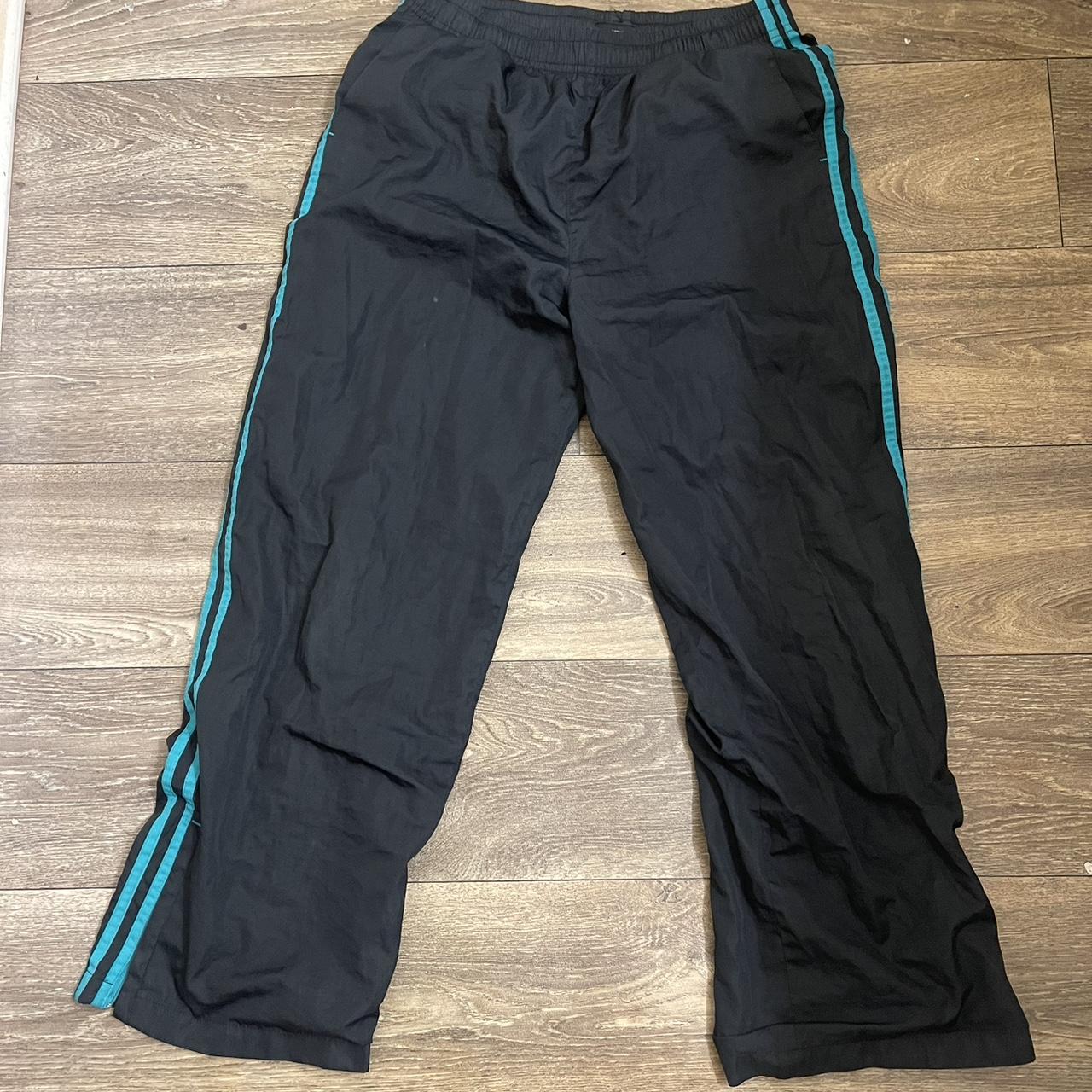 Black and green adidas track pants best sale