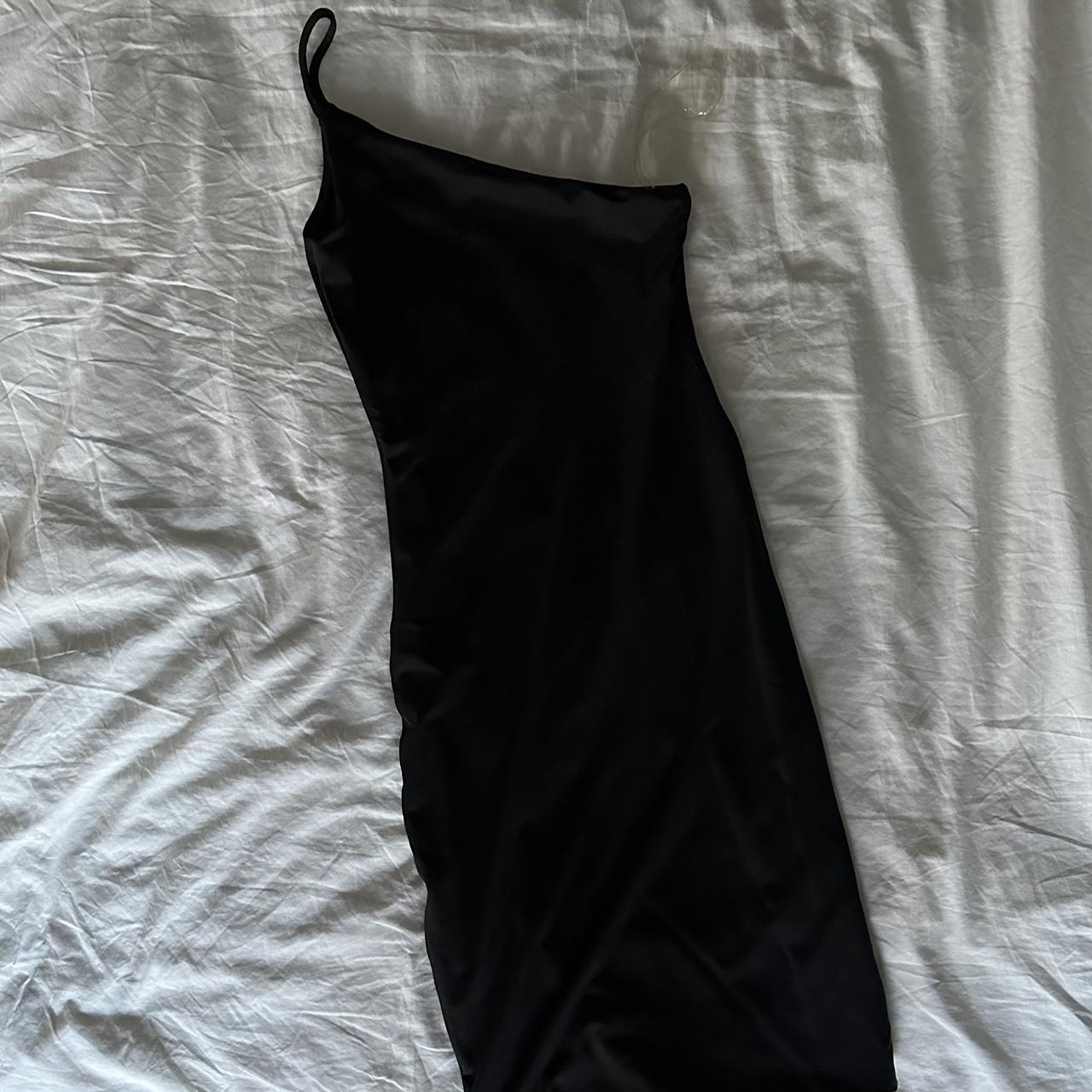 Black Asymmetrical Dress from Supre - Has a tight... - Depop