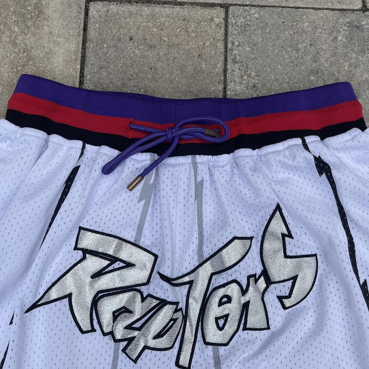 Vintage black white and red nba shorts with logo on - Depop