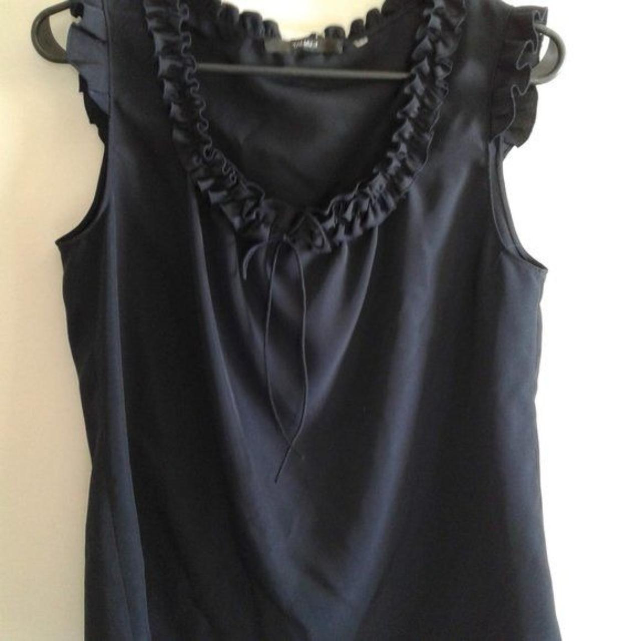 This top by TAHART is a classy dark navy color in... - Depop