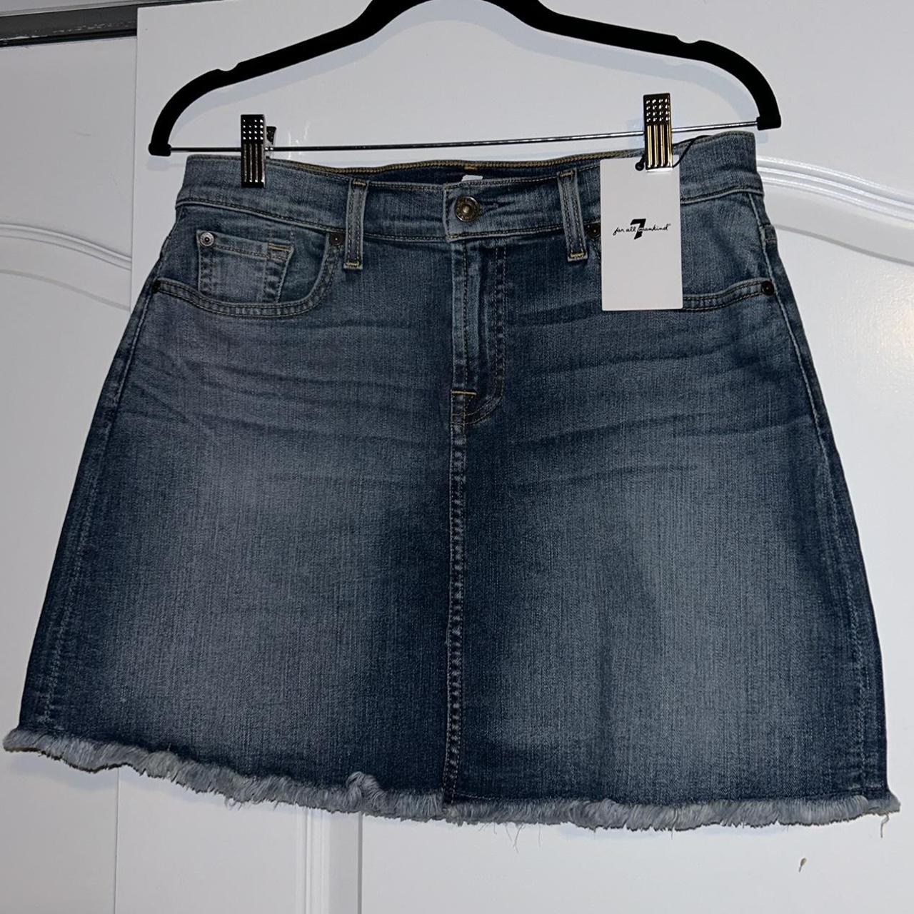 A frayed denim mini skirt designed by 7 For All... - Depop