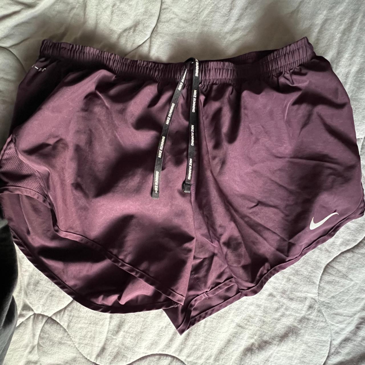 Purple Nike running shorts, tiny pocket in the back Depop