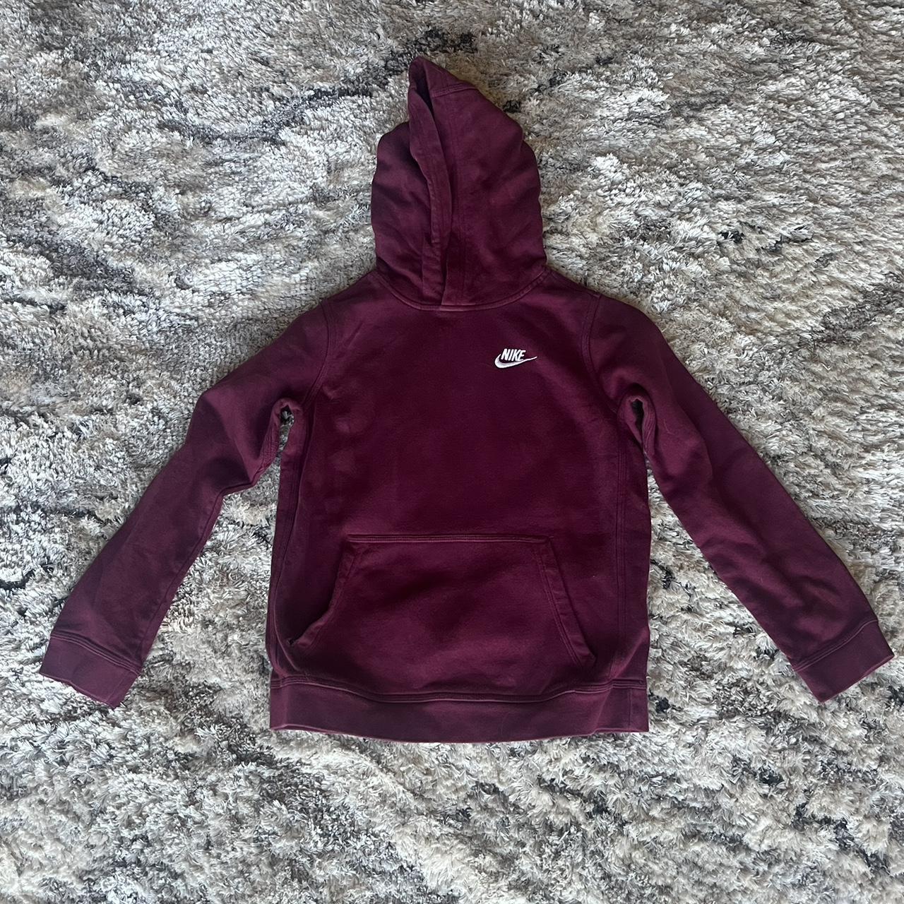 Red Nike hoodie with a small hole near the pocket... - Depop