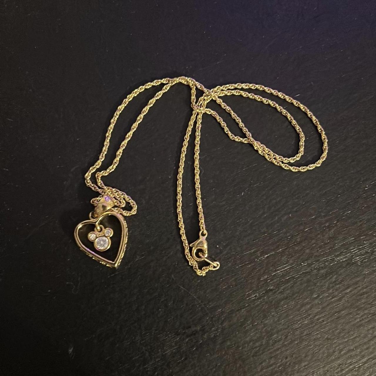 Disney filigree gold and crystal heart pendant... - Depop