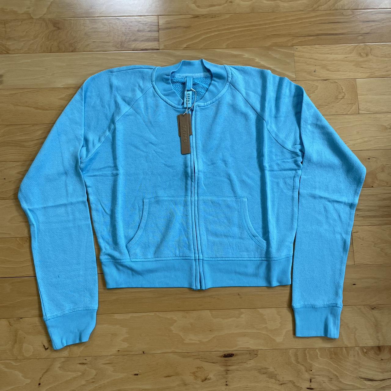 SKIMS MODAL FRENCH TERRY SHRUNKEN ZIP UP CYAN BLUE... - Depop