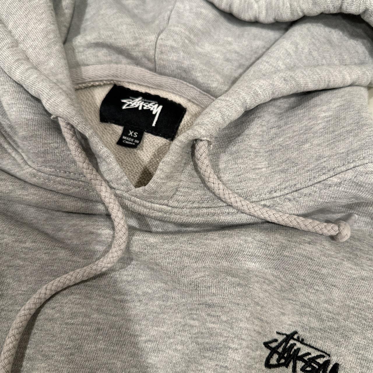 heather grey xs stussy hoodie tiny hole on the arm... - Depop