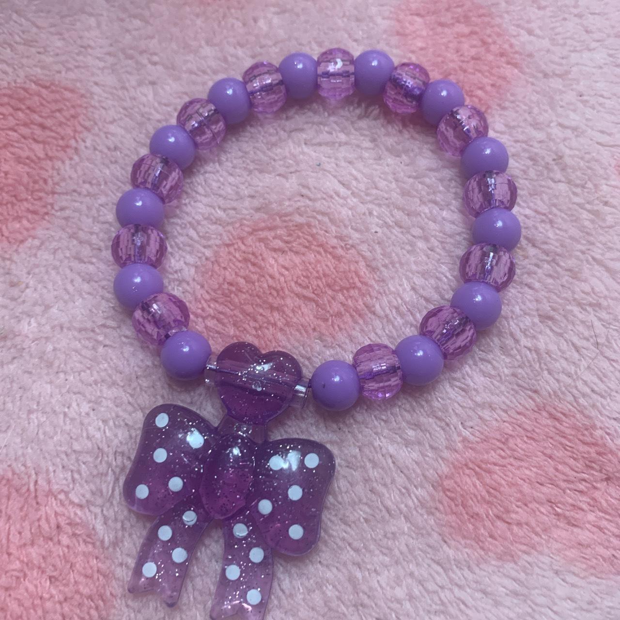 clay beads bracelets. one is purple with a flower - Depop