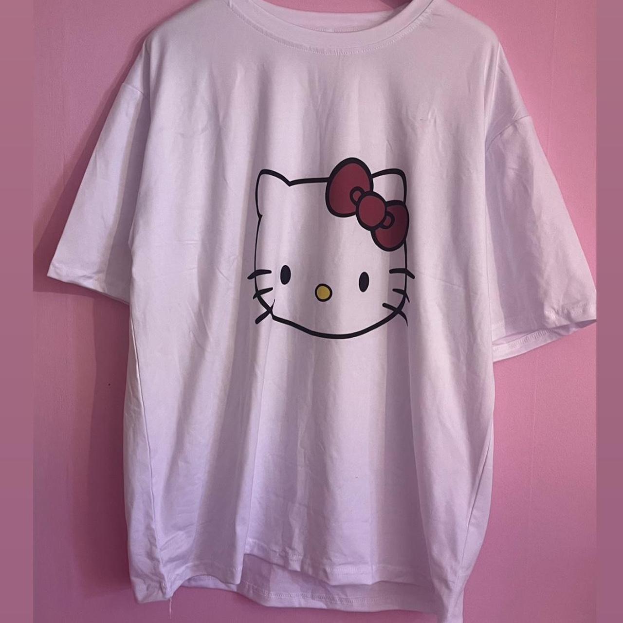 White, short sleeve Sanrio top, with hello kitty’s... - Depop