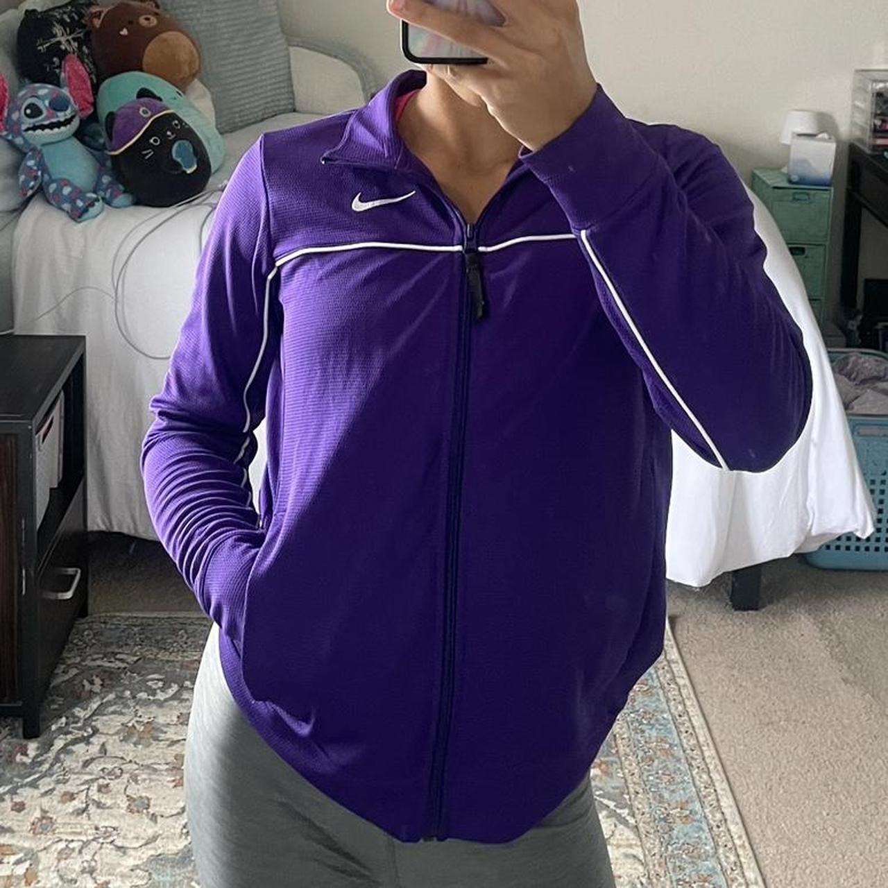 purple Nike jacket says XS but fits bigger i m a